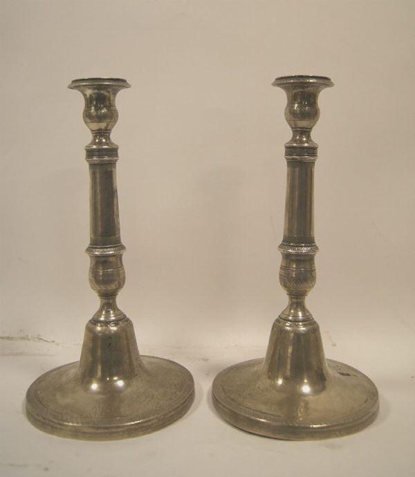 Coppia di candelieri, sec. XIX, in argento gr. 505, alt. cm 25
