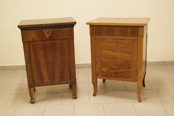Due comodini, sec. XIX, in legno a uno sportello e internamente a due cassetti, cm 59x47x83 e 56x39x85, difetti e restauri