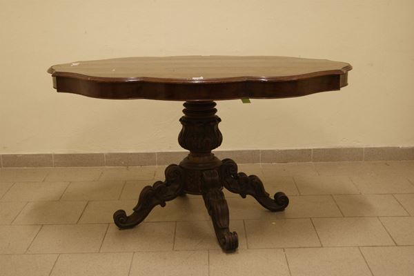 Tavolo da centro, Toscana sec. XIX, in legno sagomato a due cassetti con gamba centrale tornita, cm 130x83, danni
