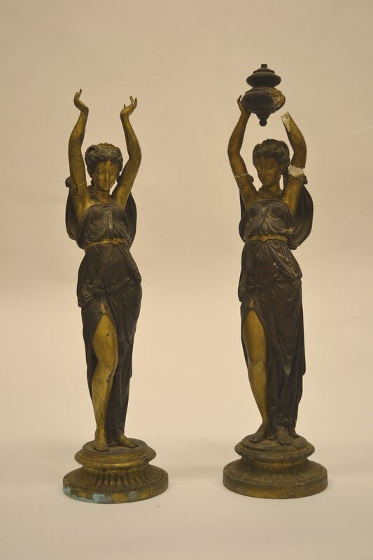 Coppia di statuine, sec. XIX, in gesso e metallo, alt. cm 71, mancanze
