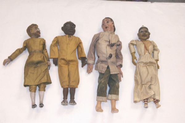 Quattro piccole marionette, inizi sec. XX, in legno,  tre di cm 40 e una di cm 50