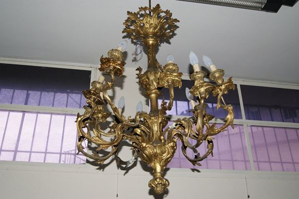 Lumiera, sec. XX in bronzo dorato a dodici bracci  - Asta Arredi e Oggetti d'Arte, Mobili e Dipinti Antichi - Poggio Bracciolini Casa d'Aste