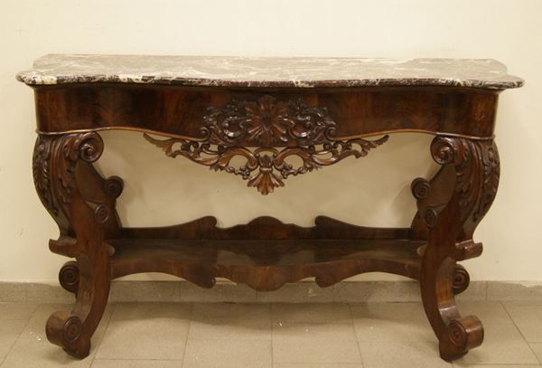 Console, Italia meridionale, sec. XIX, in mogano sagomato e intagliato, con sottopiano, gambe mosse, piano in marmo, cm 159x53x96