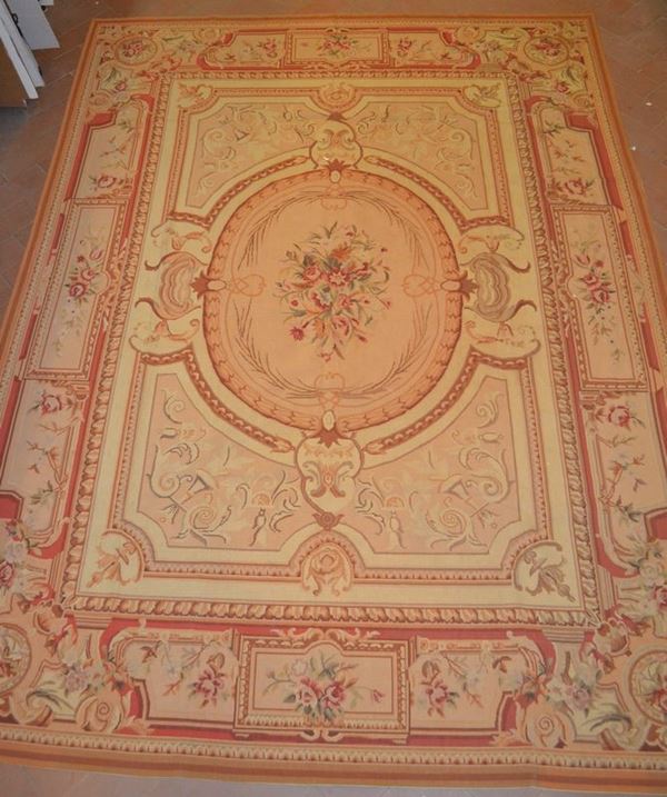 Tappeto, sec. XX,  lavorato a piccolo punto con motivo a tutto campo a motivo floreale, bordura color ruggine, cm 355x260