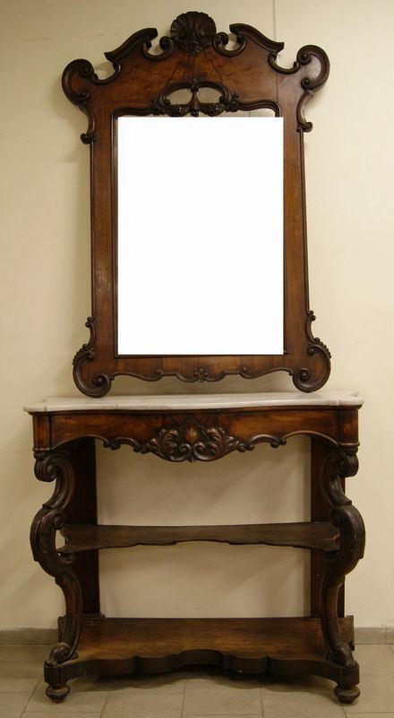 Console, Luigi Filippo, sec. XIX, in noce intagliato e sagomato, con piano marmo e due sottopiani, sovrastante specchiera, cm 138x57x280  - Asta Arredi, oggetti d'arte, mobili antichi e argenti - Poggio Bracciolini Casa d'Aste