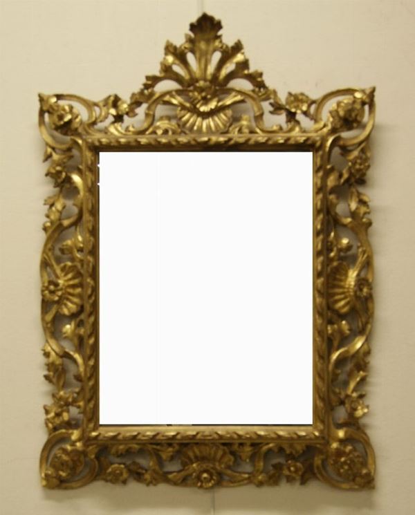 Specchiera, Toscana, sec. XIX, in legno intagliato e traforato dorato, alt. cm 88