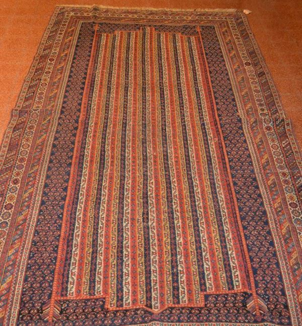 Tappeto caucasico, fondo blu con medaglione decorato da motivo di linee  floreali, molteplici bordure, cm 340x174, restauri