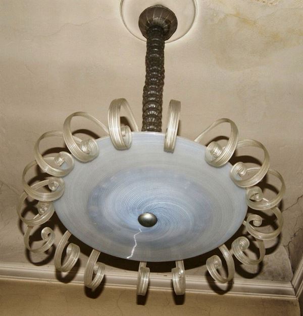 Lumiera, Deco', in vetro, decorato da diciasette elementi a volute, cinque mancanti
