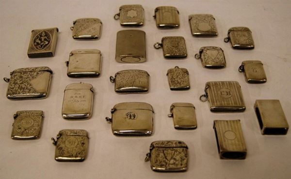 Venti portafiammiferi, in argento, inciso e lavorato, ed altri tre portafiammiferi, in metallo argentato, gr. 550(23)