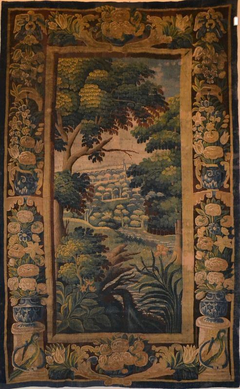 Arazzo, Aubusson, sec. XVII, al centro paesaggio boschivo con fiume,        bordura a candelabre vegetali con pappagalli alla base, cm 300x185, lievi   consunsioni