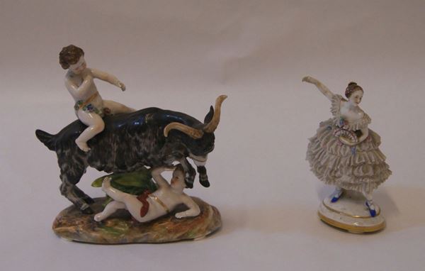 Due statuette, sec. XIX, in porcellana Capodimonte, raffigurante BALLERINA e CAPRA CON BAMBINI, alt. max cm 17(2)