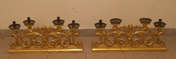 Coppia di candelieri, Toscana, sec. XVIII, in legno intagliato e dorato a cinque luci, rotture e mancanze, cm 60x11x26(2)