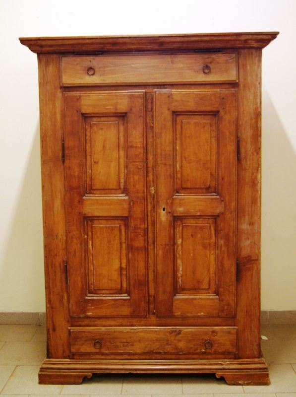 Armadio, sec. XIX, in legno, due cassetti e due sportelli sul fronte, piedi a mensola, cm 109x52x172, restauri