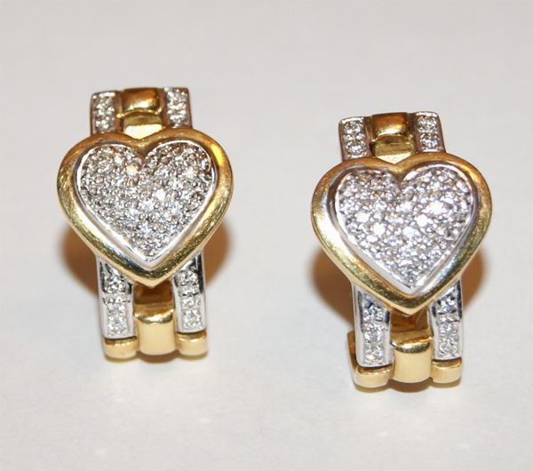 Paio di orecchini, in oro giallo e bianco, con cuore e pave' di brillantini, marca Torrini, ct 0,89, gr. 14,5 (2)