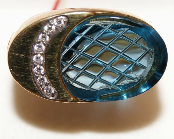 Anello, in oro giallo, con brillanti a binario e topazio, marcato Torrini, ct 0,38 e gr. 15,2