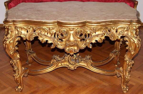 Tavolo, Italia centrale, primi sec. XX, in legno intagliato e dorato, con piano in marmo, cm 130x76x77