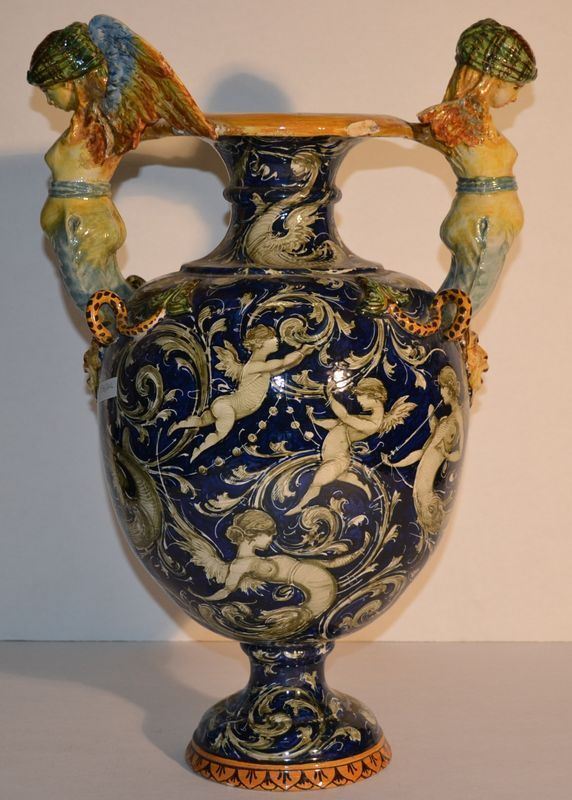 Vaso, Molaroni, Pesaro, sec. XX, in ceramica fondo blu con decoro a girali  ed animali fantastici, due anse modellate a figure femminili alate, alt. cm 52, danni