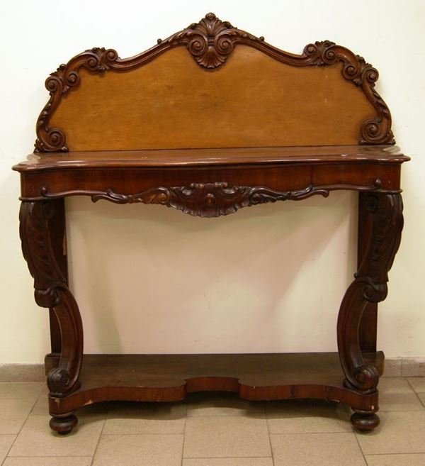 Console, Toscana, sec. XIX, in mogano intagliato, sostegni anteriori arcuati, piadi a cipolla, con alzata sagomata, cm 130x56x150