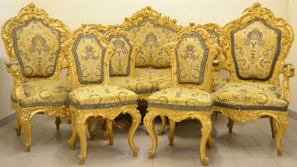 Salotto, Firenze capitale, sec XIX, composto da divano, due poltrone e quattro sedie in legno intagliato e dorato con finali a teste di animali imbottite e ricoperte in stoffa