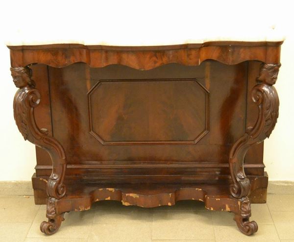 Console Luigi Filippo, sec. XIX, in mogano sagomato con sostegni intagliati a teste femminili e sottopiano, piano in marmo, cm 125x58x97