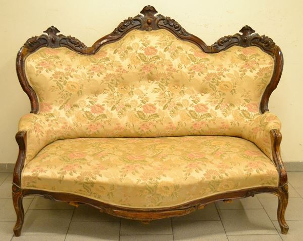Divano, Luigi Filippo, sec. XIX, in mogano intagliato e sagomato, ricoperto in stoffa a fiori, cm 164x65x123