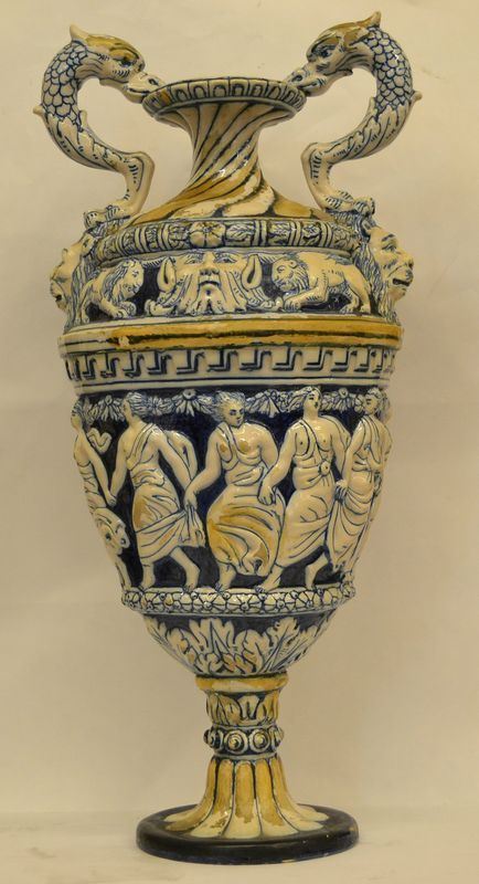 Vaso, Mollaroni, Pesaro, sec. XX, in ceramica decorata a rilievo ad animali e figure in abiti classici, alt. cm 59, danni