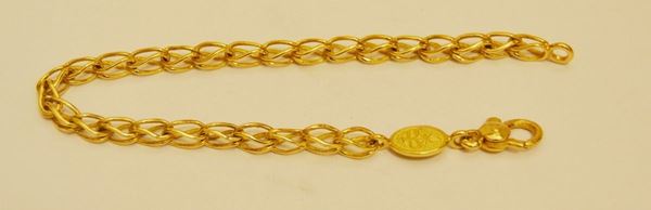 Bracciale in oro giallo, a maglia intrecciata, g 10,3, marcato Torrini