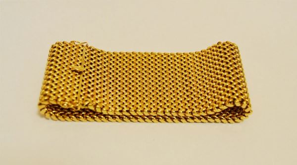 Bracciale in oro giallo a fascia larga a maglie snodabili, g 75,5