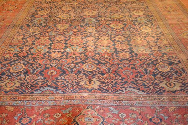 Tappeto persiano, fondo blu con decori vegetali stilizzati nei toni del verde e azzurro, molteplici bordure, cm 360x420, consunzioni e danni