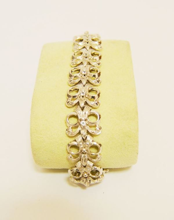 Bracciale in oro bianco a maglie snodate, con zaffiri bianchi, g 31,4
