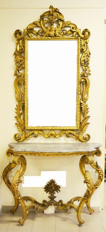 Console, sec. XIX, in legno intagliato e dorato, con piano in marmo e specchiera, cm 127x57x287, piccole mancanze