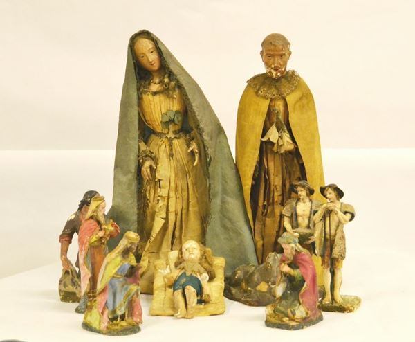 Presepe, Napoli sec. XIX, composto da dieci personaggi in vari materiali, difetti e rotture (10)
