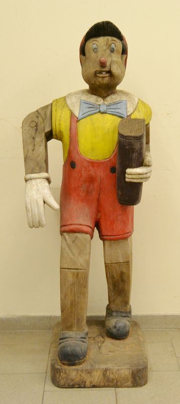 Scultura, sec. XX, in legno, raffigurante PINOCCHIO, alt. cm 150