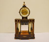 Orologio da tavolo, sec. XIX, in noce modellato a tempietto con applicazioni in metallo dorato e colonne in alabastro, quadrante con numeri arabi, alt. cm 50, meccanismo da revisionare e alcuni danni