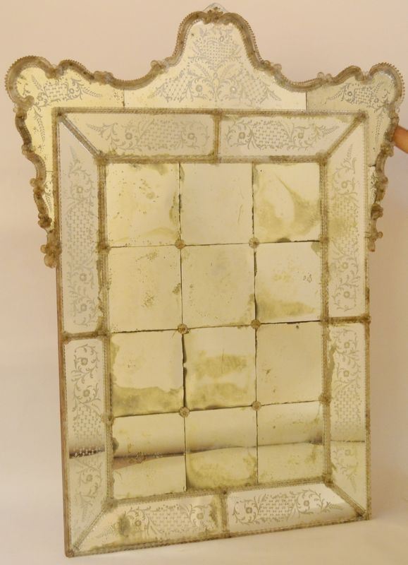 Specchiera, Murano, 1930-40, in vetro intagliato e molato a motivi vegetali e floreali, cm 182x140