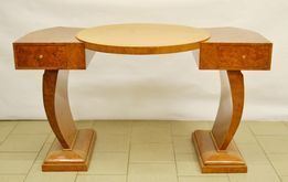 Scrivania decÃ², Francia sec. XX, in radica, a quattro cassetti, piano circolare, gambe mosse, cm 143x80x80