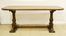 Tavolo, Toscana, sec. XIX, in noce, piano sagomato, gambe a colonna riunite da traversa, cm 190x68x76,5