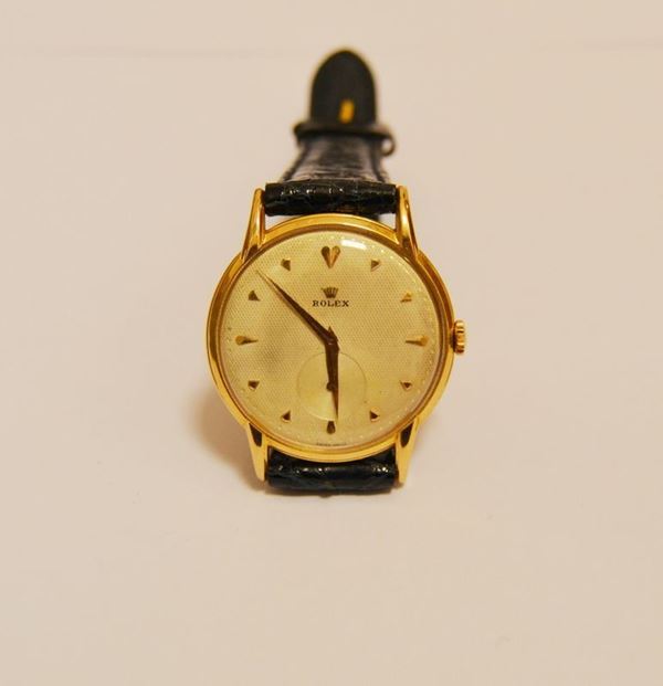 Orologio da polso rolex anni 50' , cassa in oro giallo, quadrante a nido d'ape, movimento manuale, cinturino in pelle