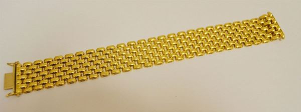 Bracciale in oro giallo a fascia  larga a maglie snodate g 46  - Asta Arredi, oggetti d'arte, dipinti - Poggio Bracciolini Casa d'Aste