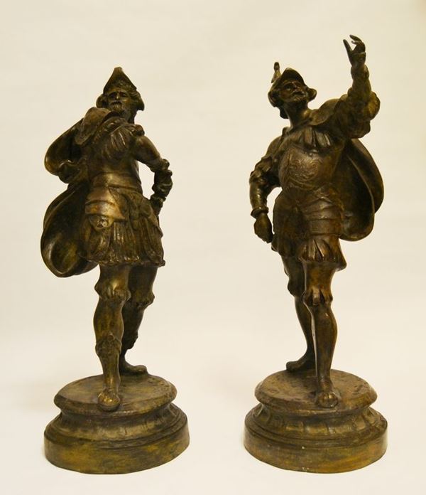 Coppia di sculture, GUERRIERI, sec. XX, in bronzo, alt. cm 56, firmate  (2)
