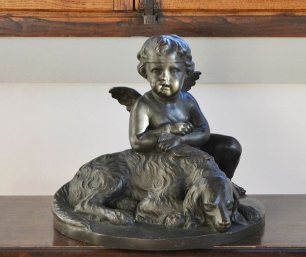 Scultura, sec. XX, in bronzo, PUTTO CON CANE, su base ovale, cm 44x40