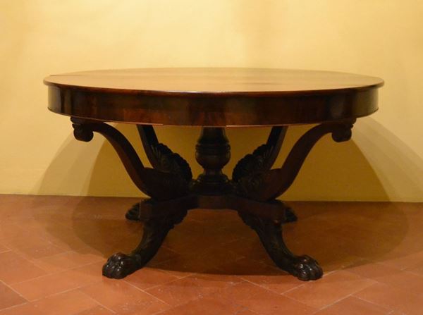 Tavolo, Inghilterra, sec. XIX, in mogano, piano circolare allungabile, base a cestello, due prolunghe, diam. cm 145, alt. cm 75