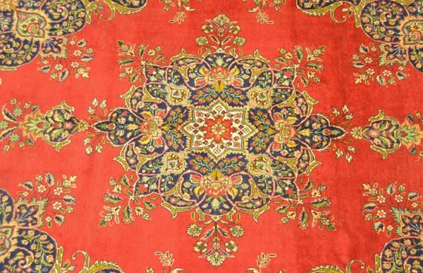 Tappeto persiano TABRIZ, di vecchia manifattura, fondo rosso a motivo floreale, cm 395x290