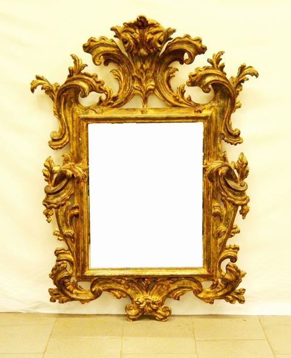 Specchiera, Toscana, sec. XX, in legno laccato e intagliato a motivi vegetali, cm 96x131
