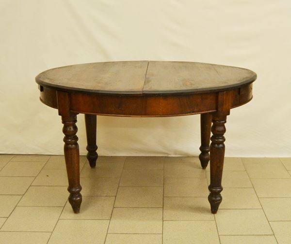 Tavolo, Toscana, sec. XIX, piano ovale allungabile, quattro gambe tornite, cm 136,5x109x77, mancanze