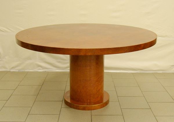 Tavolo, anni 80, in laminato, piano circolare su fusto a cilindro, diam. cm 137, alt. cm 74
