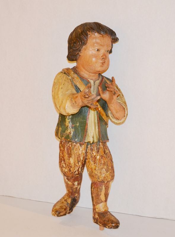 Scultura da presepe, sec. XVIII, rappresentante pastorello, in legno policromo, alt. cm 51, danni e restauri
