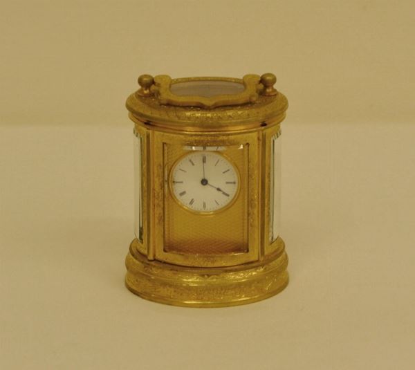 Piccolo orologio Ufficialina, Parigi, metÃ  sec. XIX, in bronzo dorato con meccanismo ad ancora, bilanciere su carro mobile, carica 8 giorni
