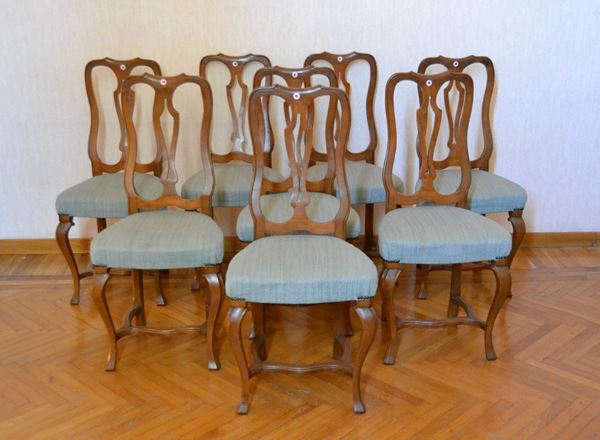 Otto sedie, in stile 700, in noce, spalliera traforata, sedute imbottite e ricoperte in stoffa azzurra