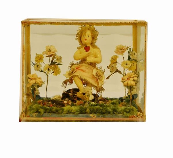 Sculturina, sec. XIX, in legno laccato, raffigurante GESU' BAMBINO, entro teca in vetro, difetti
